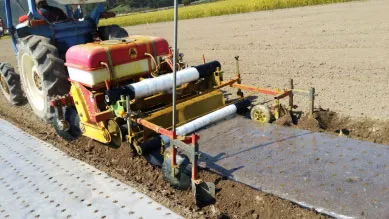 ORATEXCA GK7 BG-series multi functional mulcher operating in a field for onion and garlic farming