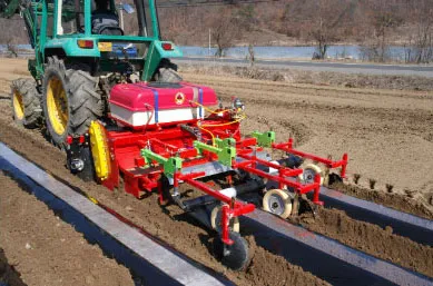 Tractor operating ORATEXCA GK7 BG-series laying plastic mulch perfectly tightly